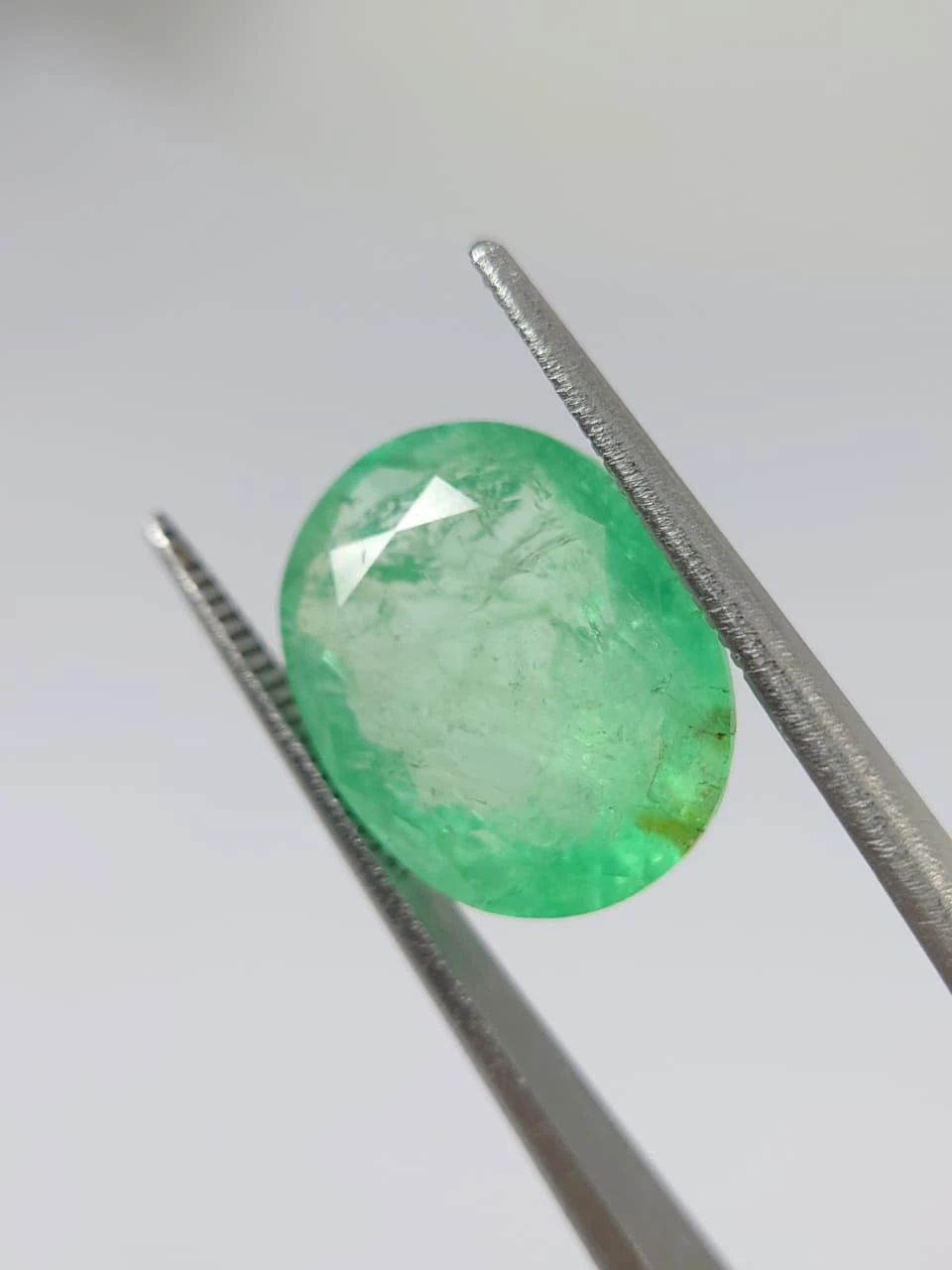 7.7ct Oval Faceted Minor Oiled Panjshir Emerald from Afghanistan — view 6